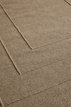 Brink & Campman Senso Border Fur Brown rug in camel brown with three frames in relief, shown in an interior, second view