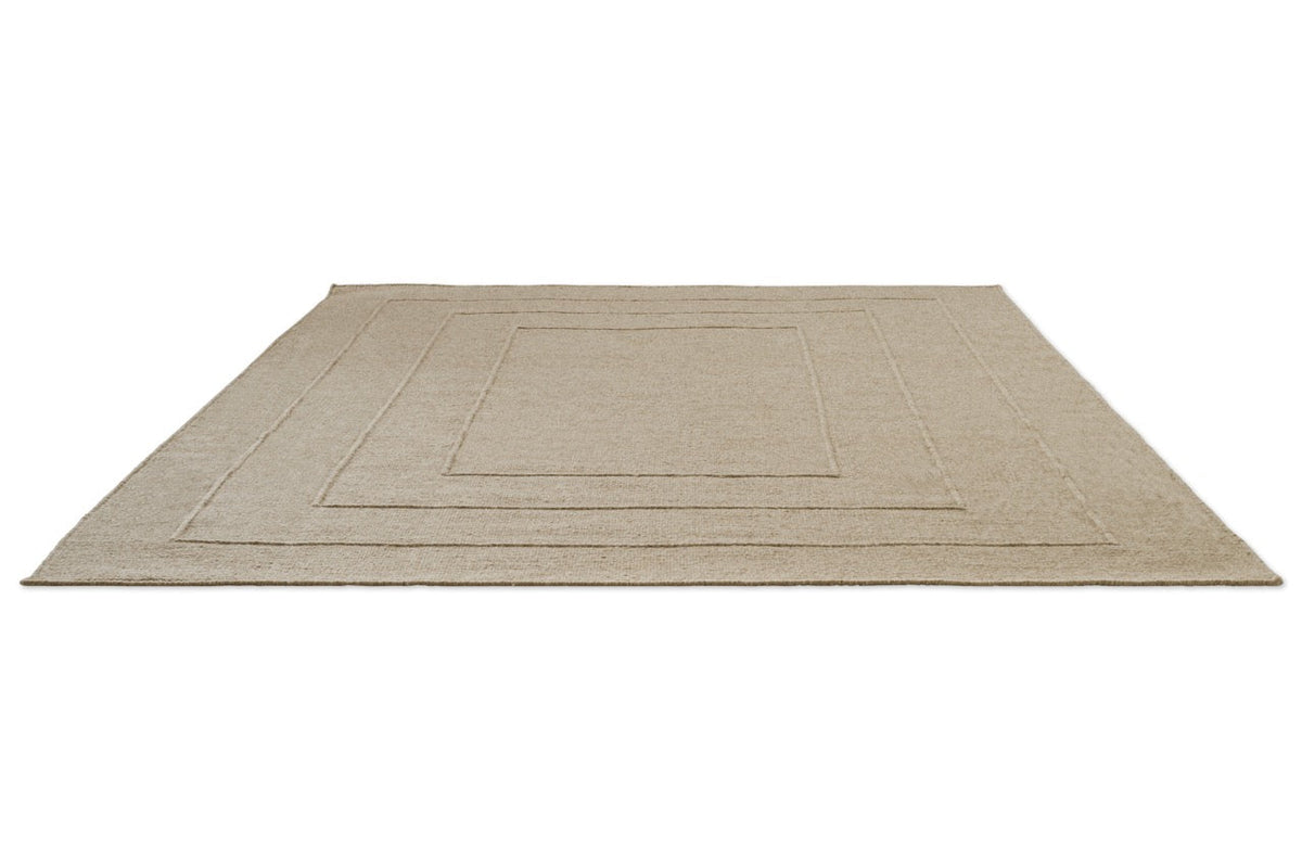 Brink & Campman Senso Border Natural rug in sand beige with three frames in relief, perspective view