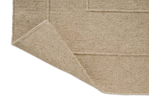 Brink & Campman Senso Border Natural rug, detail of folded corner and reverse side
