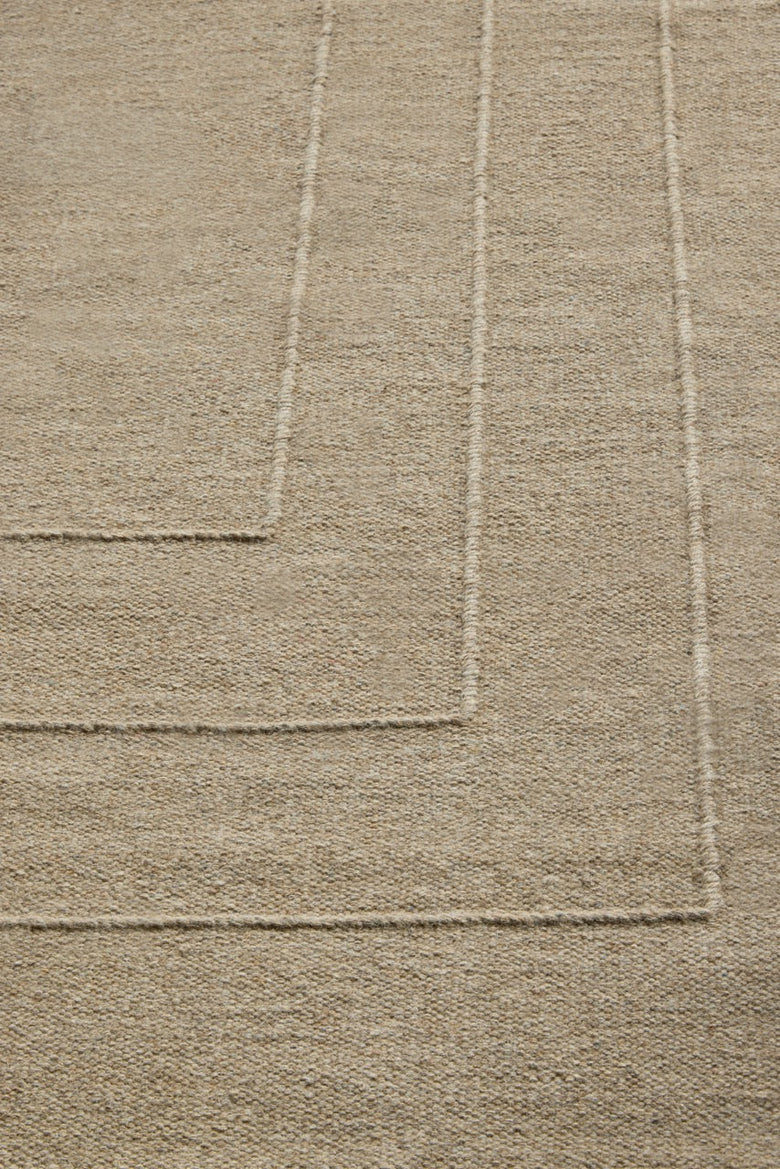 Brink & Campman Senso Border Natural rug in sand beige with three frames in relief, shown in an interior, second view