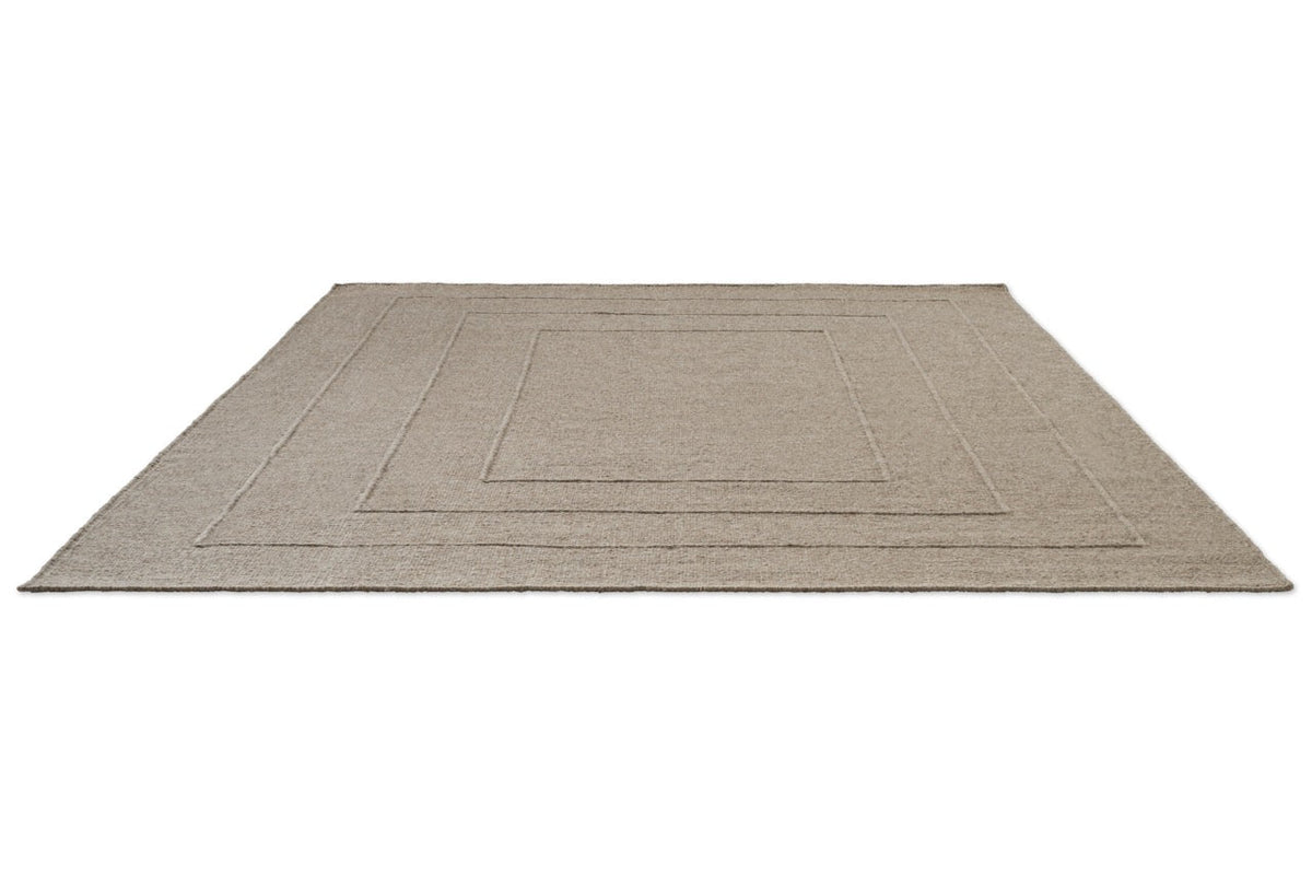 Brink & Campman Senso Border Soft Taupe rug in grey taupe with three frames in relief, perspective view