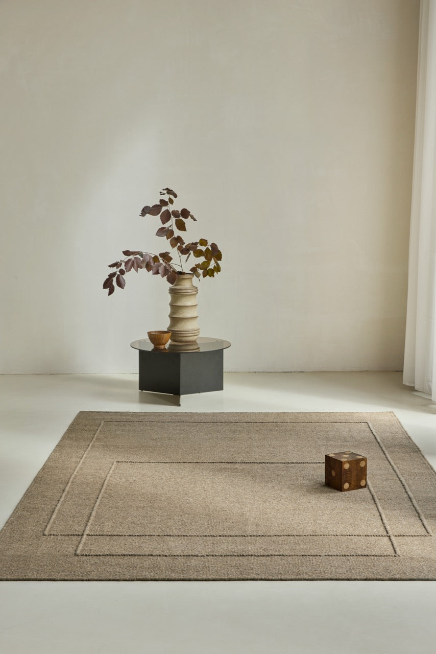 Brink & Campman Senso Level Fur Brown rug in camel brown with two rectangles in relief, shown in an interior
