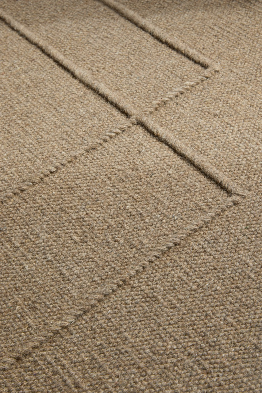Brink & Campman Senso Level Fur Brown rug in camel brown with two rectangles in relief, shown in an interior, second view