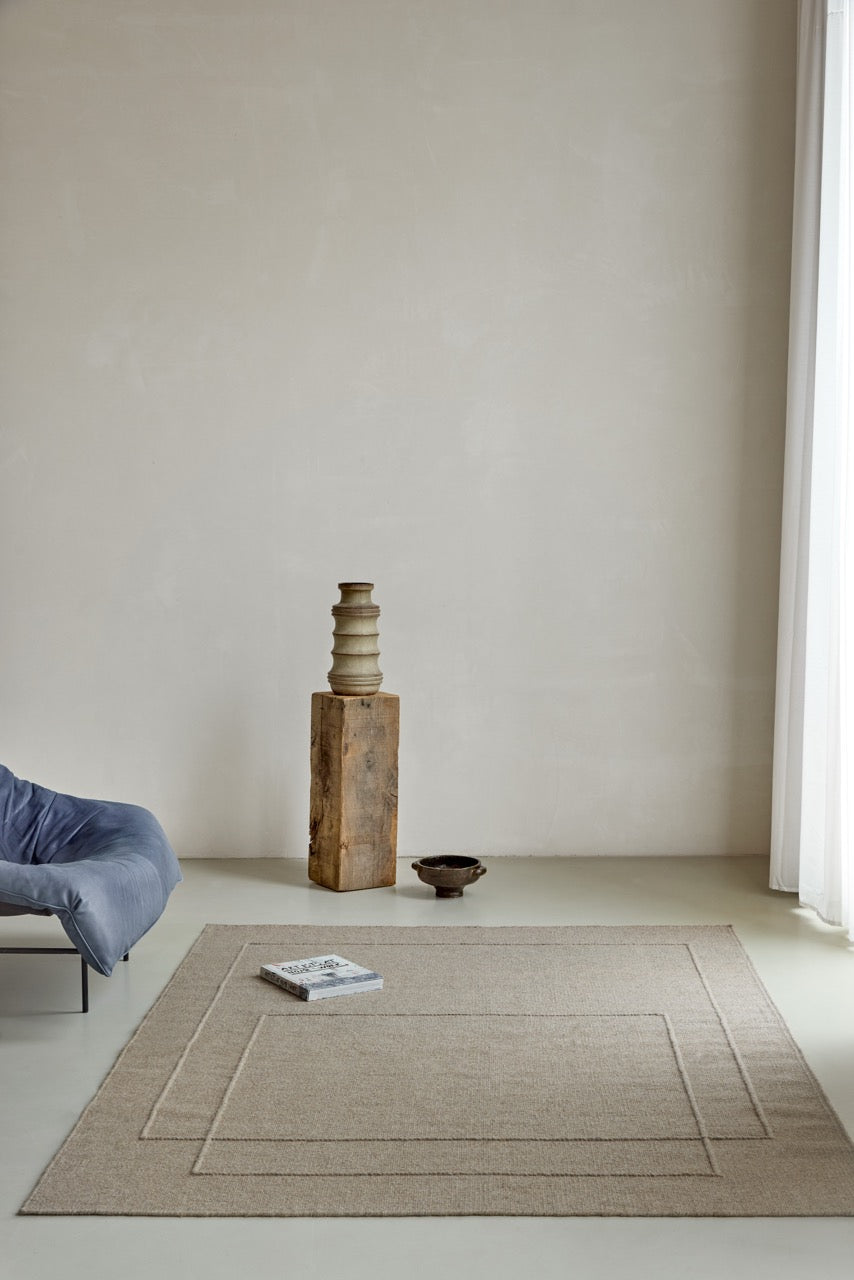 Brink & Campman Senso Level Soft Taupe rug in grey taupe with two rectangles in relief, shown in an interior