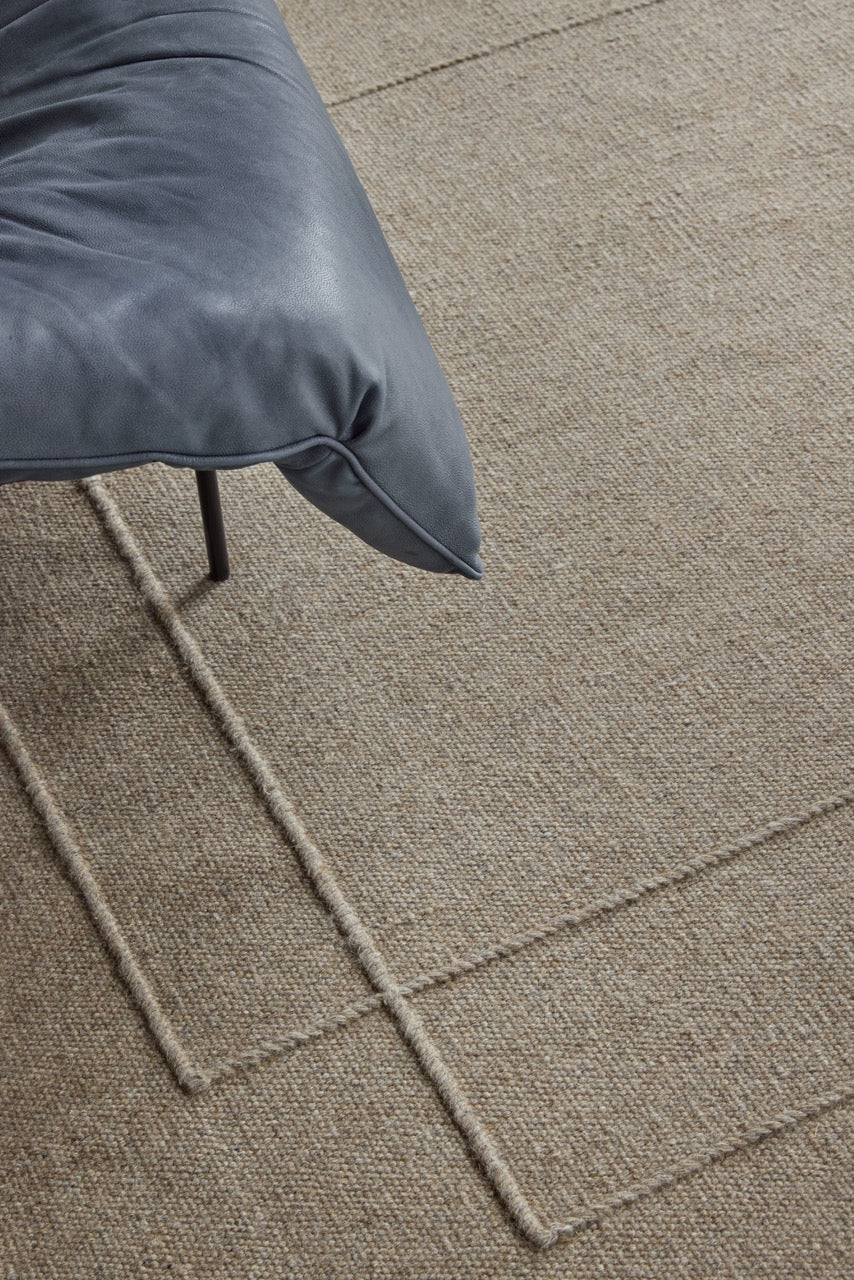 Brink & Campman Senso Level Soft Taupe rug in grey taupe with two rectangles in relief, shown in an interior, second view