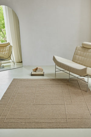 Brink & Campman Senso Planes Fur Brown rug in camel brown with overlapping rectangles in relief, shown in an interior