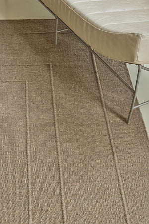 Brink & Campman Senso Planes Fur Brown rug in camel brown with overlapping rectangles in relief, shown in an interior, second view