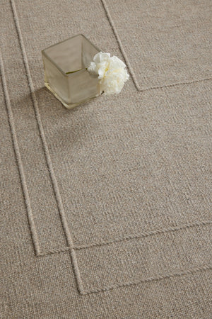 Brink & Campman Senso Planes Soft Taupe rug in grey taupe with overlapping rectangles in relief, shown in an interior, second view