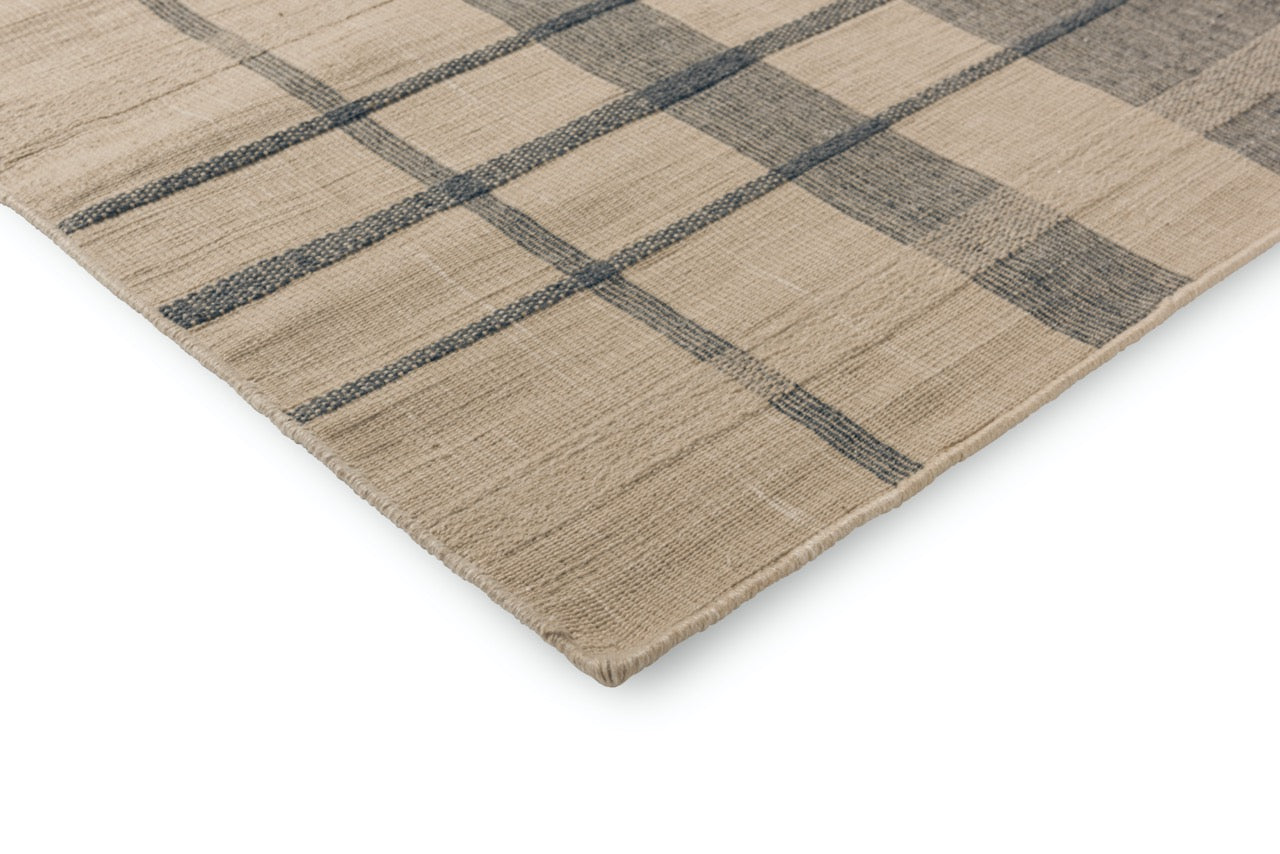 Close-up of rug edge showing clean finishing and texture
