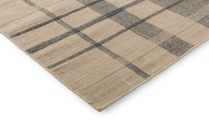 Close-up of rug edge showing clean finishing and texture