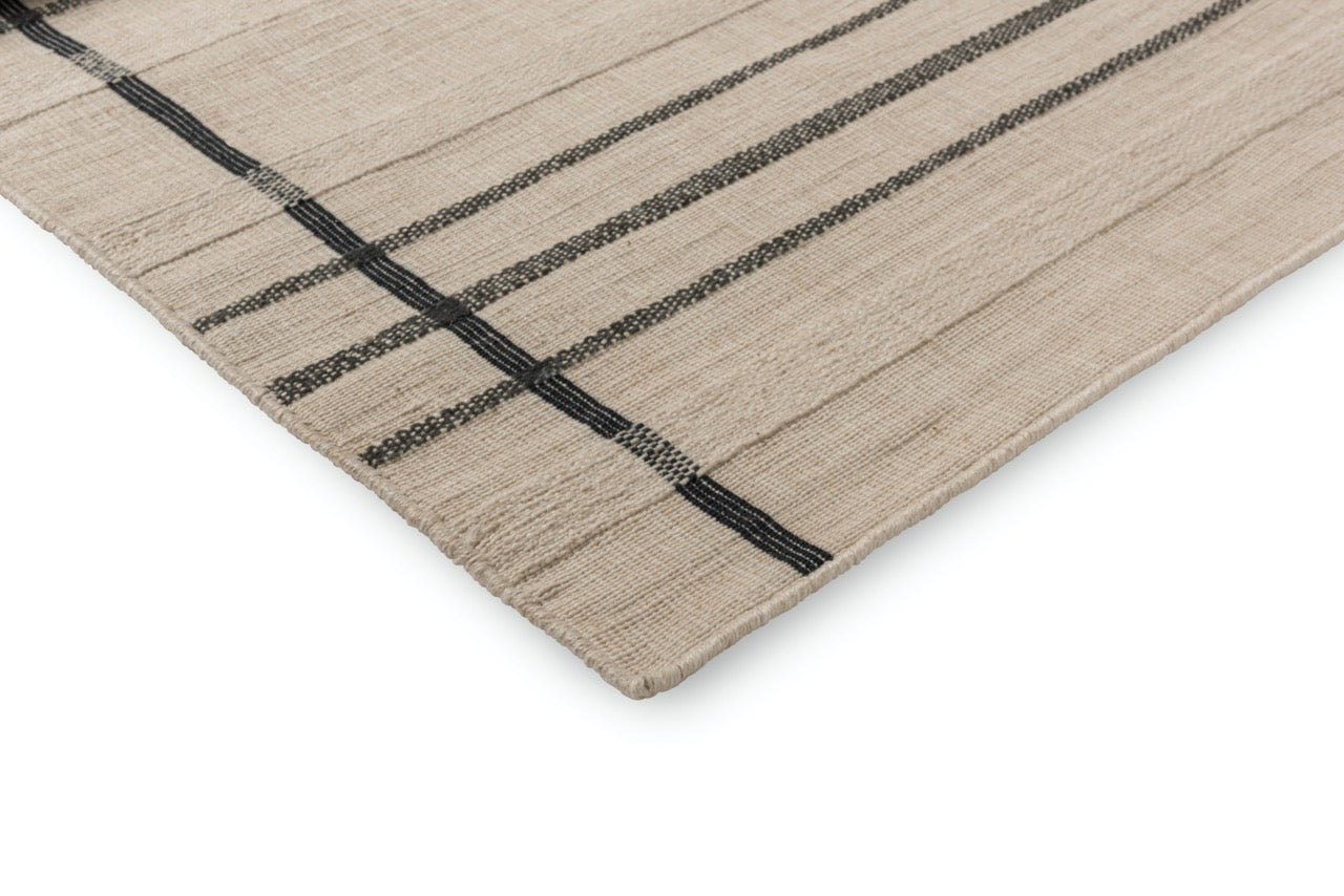 Close-up of flatweave texture with linear pattern in charcoal tones