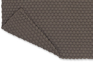 Close-up of recycled PET flatweave texture in soft grey and taupe tones

