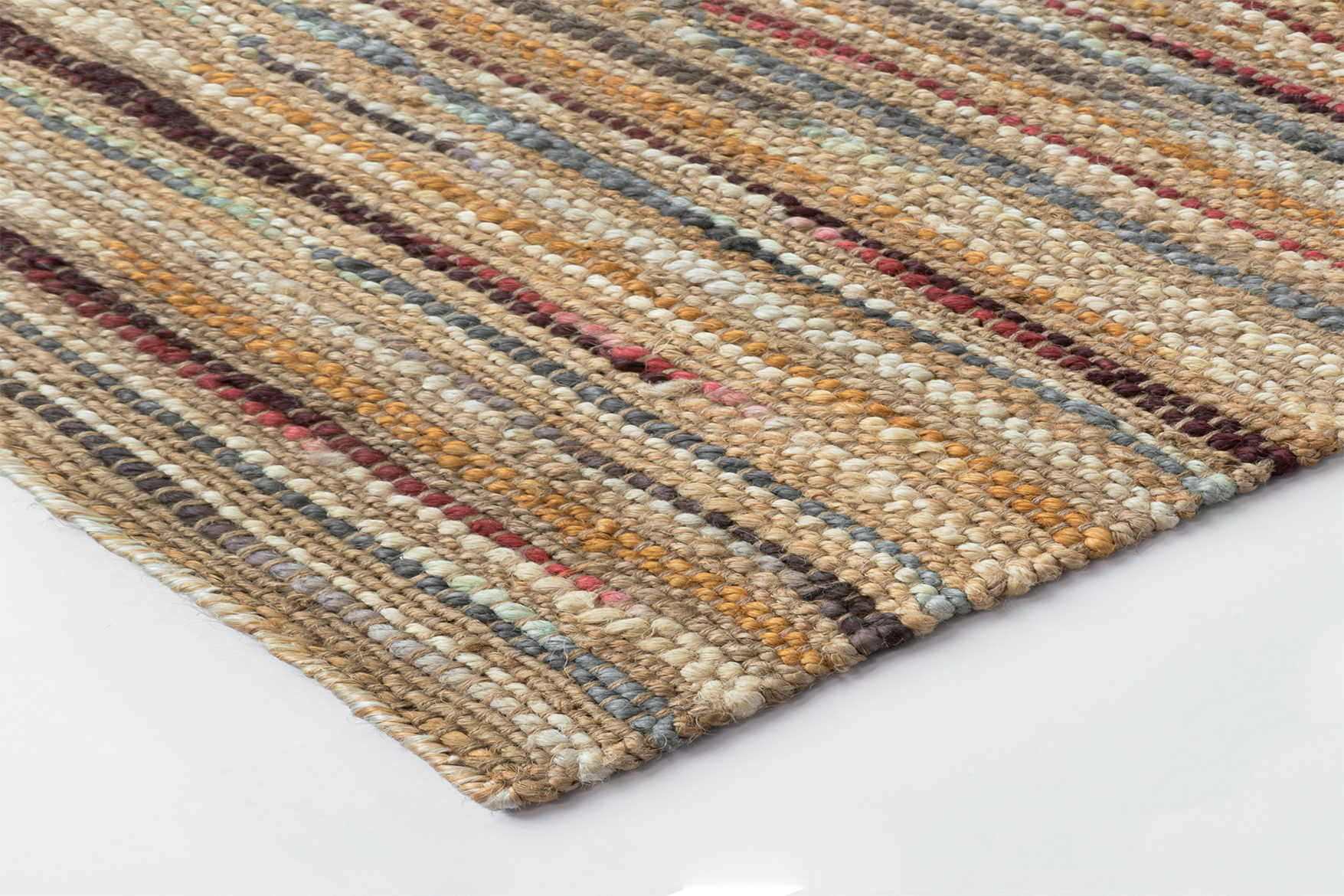 Corner detail of the Acsento Bilbao Multi rug showcasing its flatweave construction and clean edges

