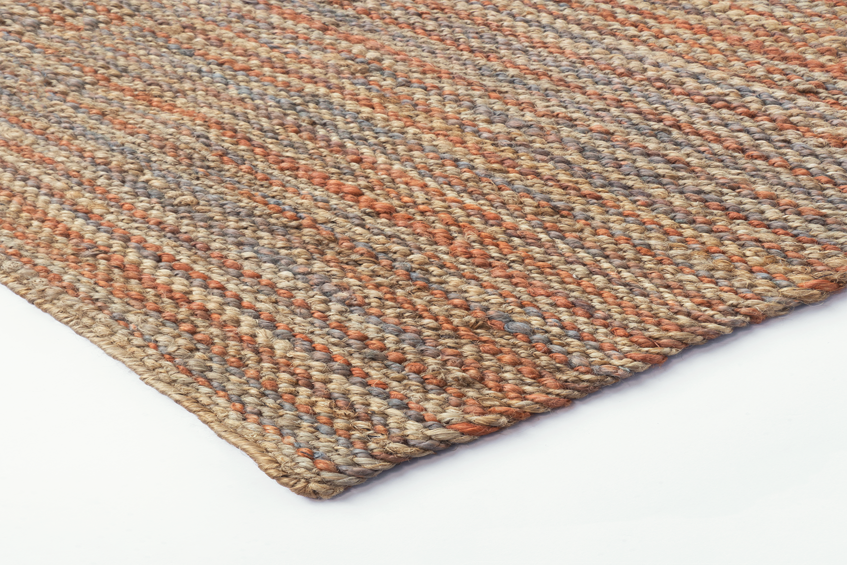 Corner detail of Acsento Bilbao Terra rug with flatweave finish and rich earthy tone

