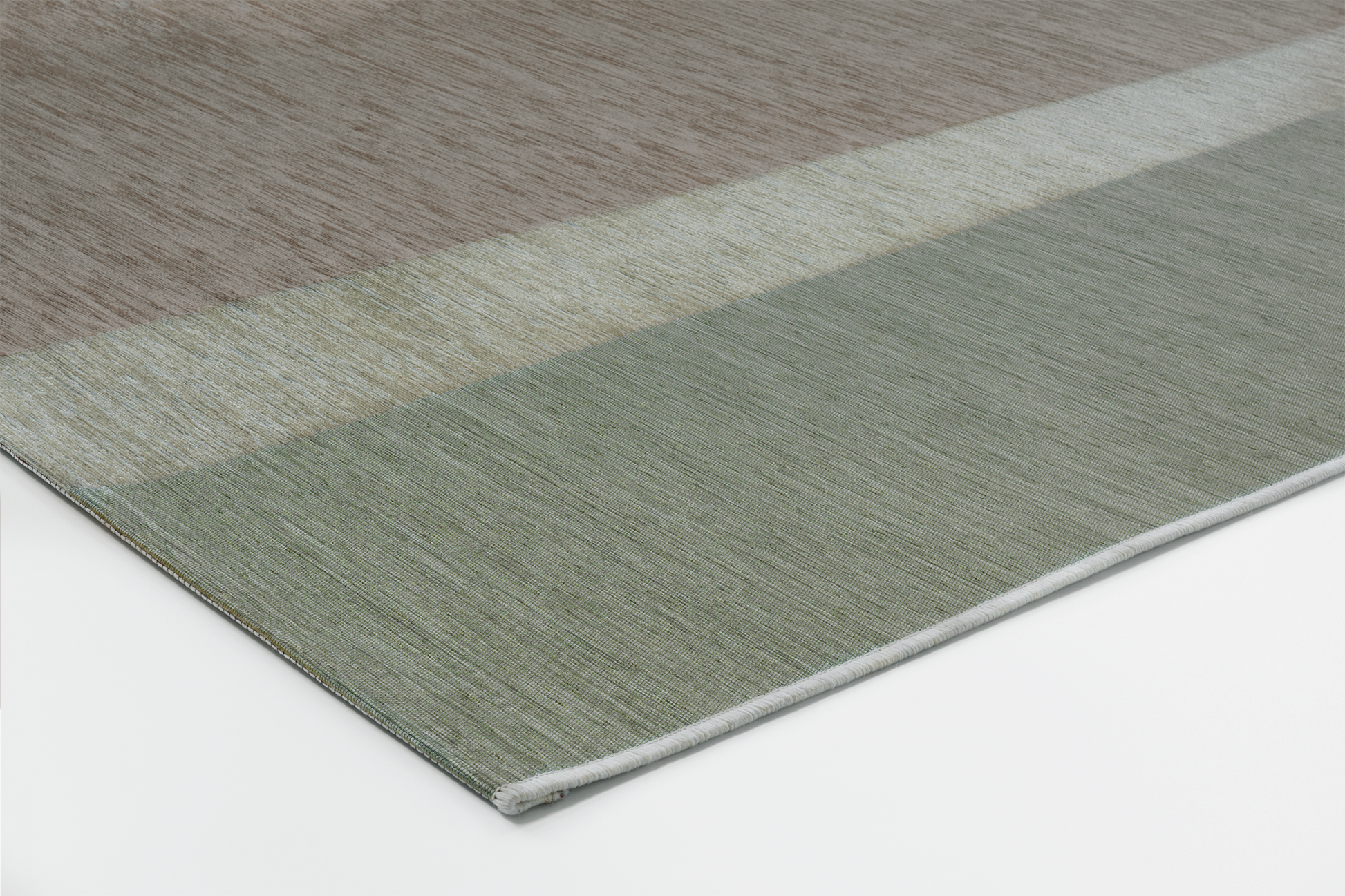 Corner of Acsento Capri Natural Sage rug with slim profile and precise Belgian finish


