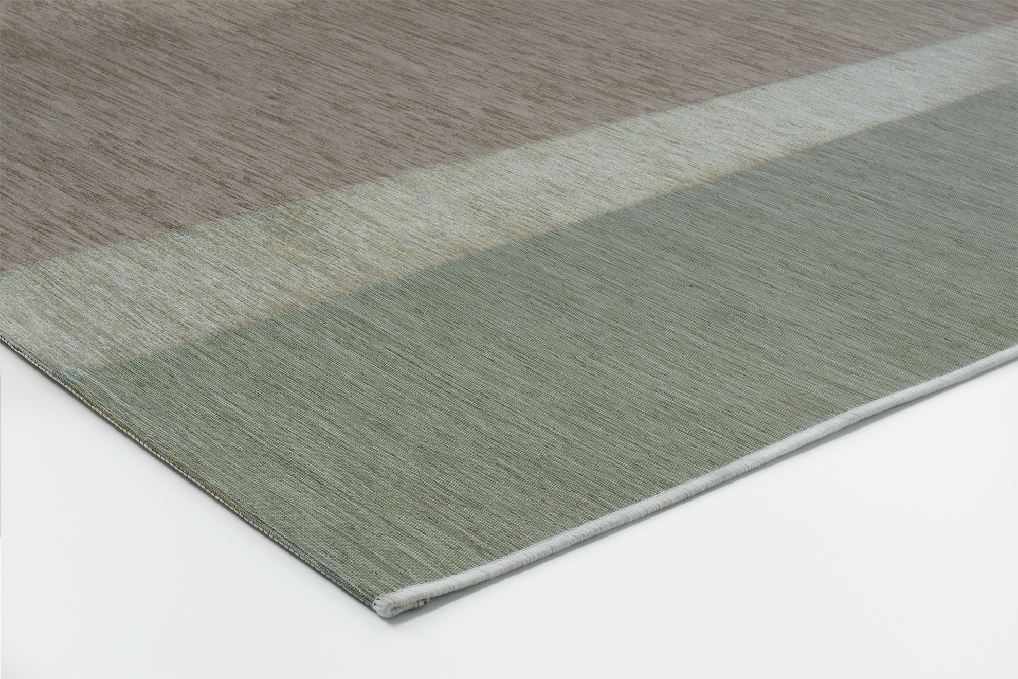 Corner of Acsento Capri Natural Sage rug with slim profile and precise Belgian finish

