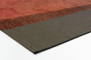 Corner of Acsento Capri Terra Forest rug showing edge detail and thin flatweave structure

