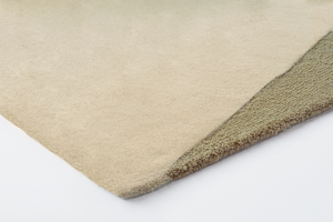 Corner detail of Acsento Figari Khaki rug with precise finish and fine patterning

