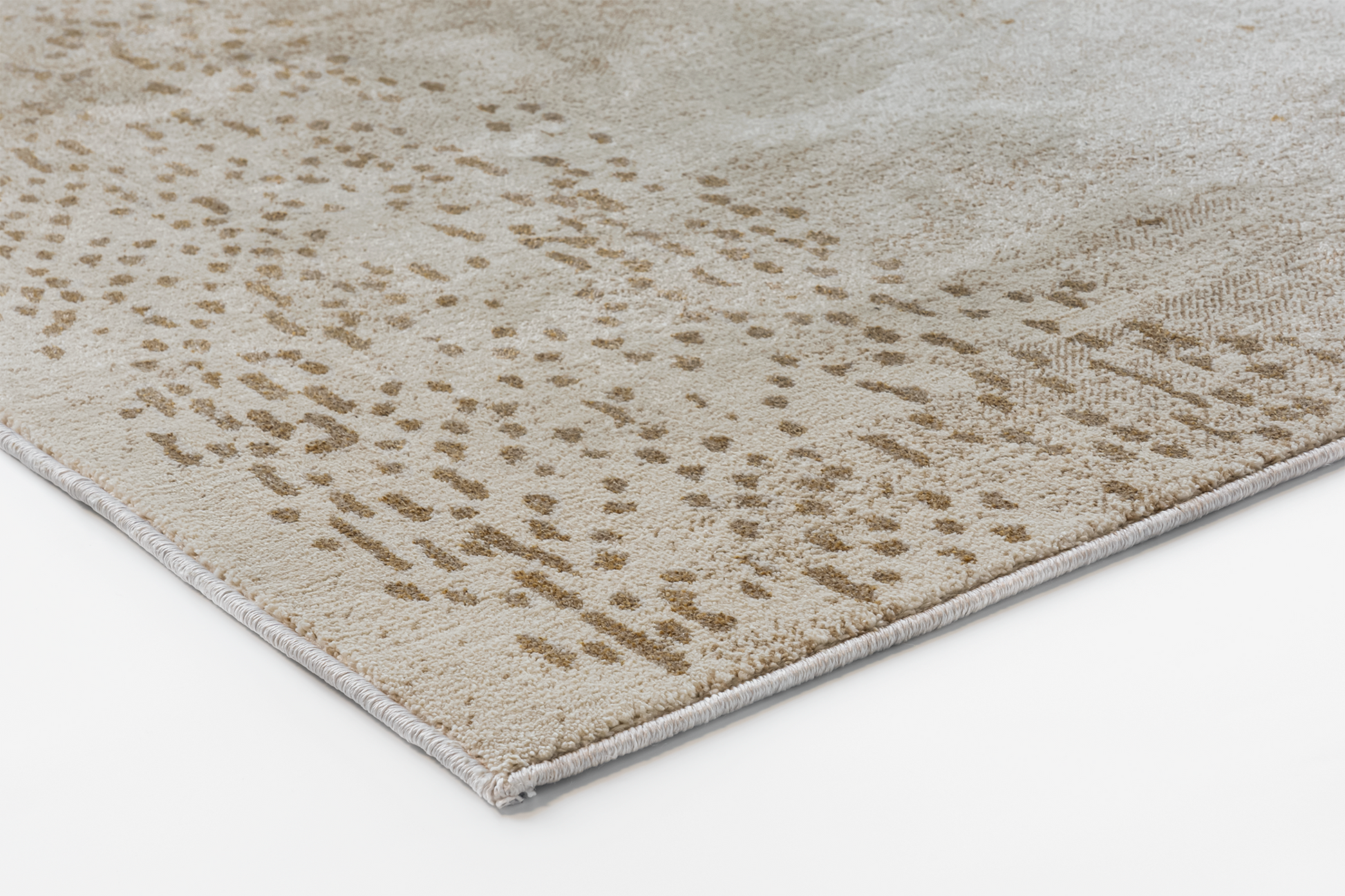 Corner detail of the Acsento Jura Beige 12 rug showcasing its flatweave construction and clean edges.

