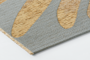 Corner detail of the Acsento Salerno Caramel rug showcasing its flatweave construction and clean edges.