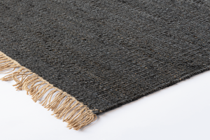 Corner of Acsento Vigo Charcoal jute rug with clean edges and low-profile flatweave finish

