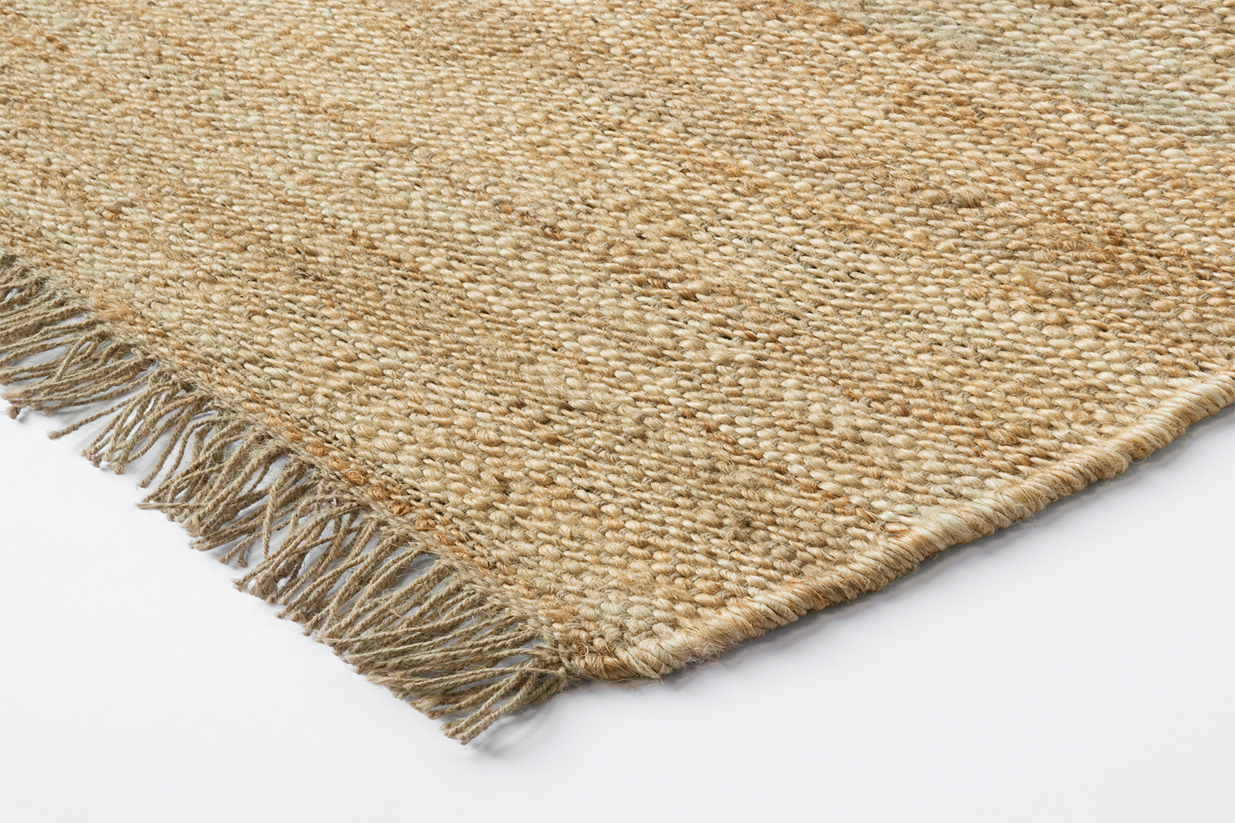 Corner detail of Acsento Vigo Natural rug with clean edge and slim flatweave construction

