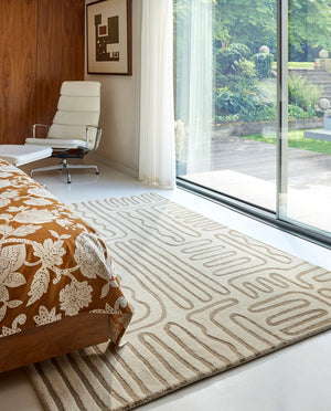 Harlequin Hollow Pebble rug in ivory with greige lines, shown in an interior