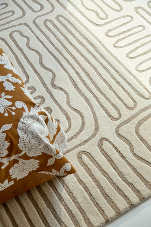 Harlequin Hollow Pebble rug in ivory with greige lines, shown in an interior, second view