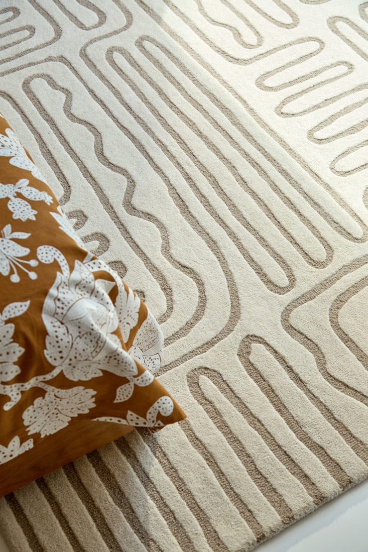 Harlequin Hollow Pebble rug in ivory with greige lines, shown in an interior, second view