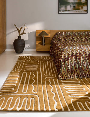 Harlequin Hollow Tan rug in caramel with ivory lines, shown in an interior