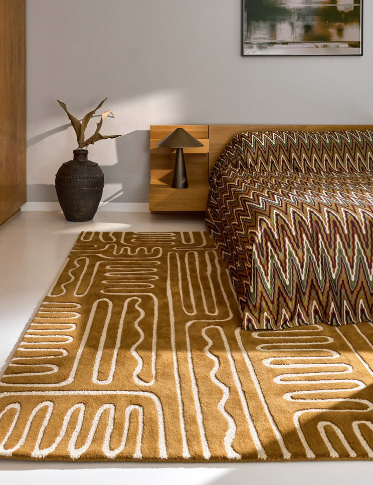 Harlequin Hollow Tan rug in caramel with ivory lines, shown in an interior
