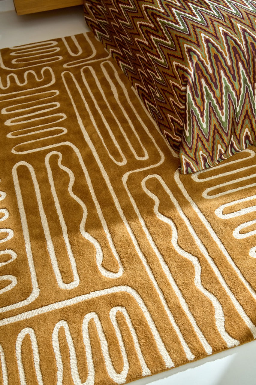 Harlequin Hollow Tan rug in caramel with ivory lines, shown in an interior, second view