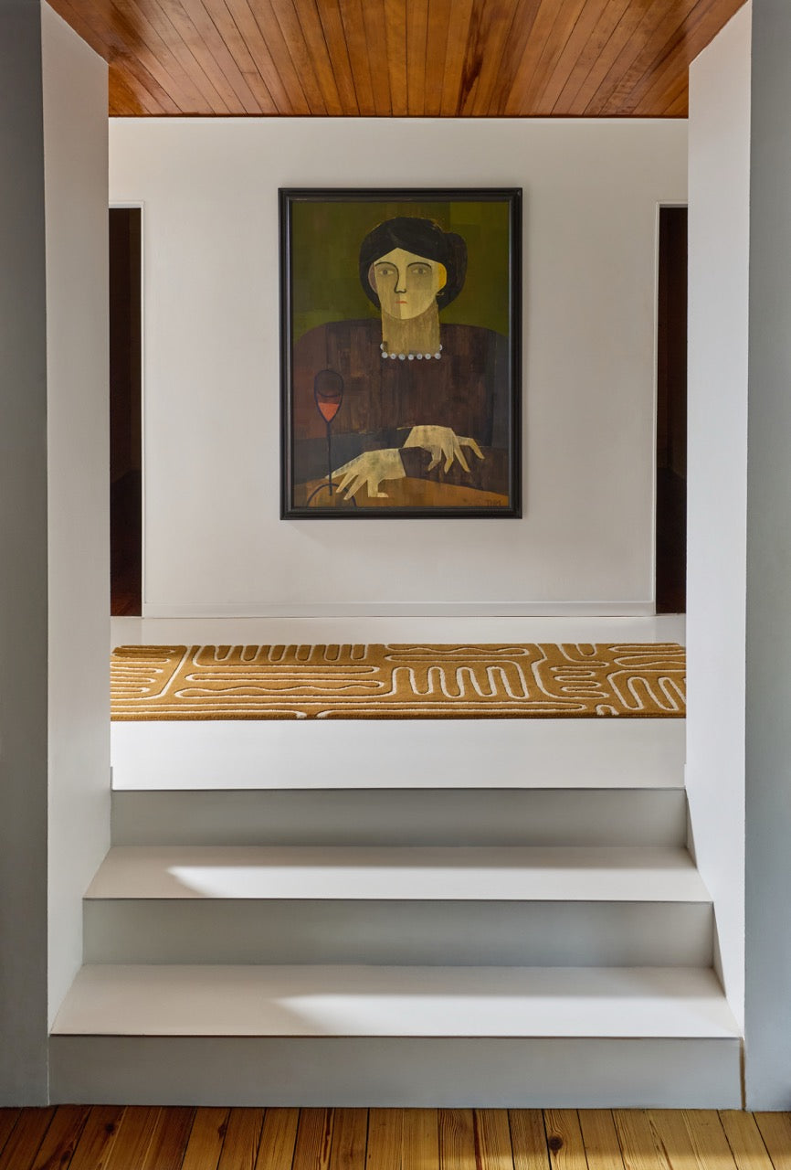 Harlequin Hollow Tan runner in caramel with ivory lines, shown in an interior