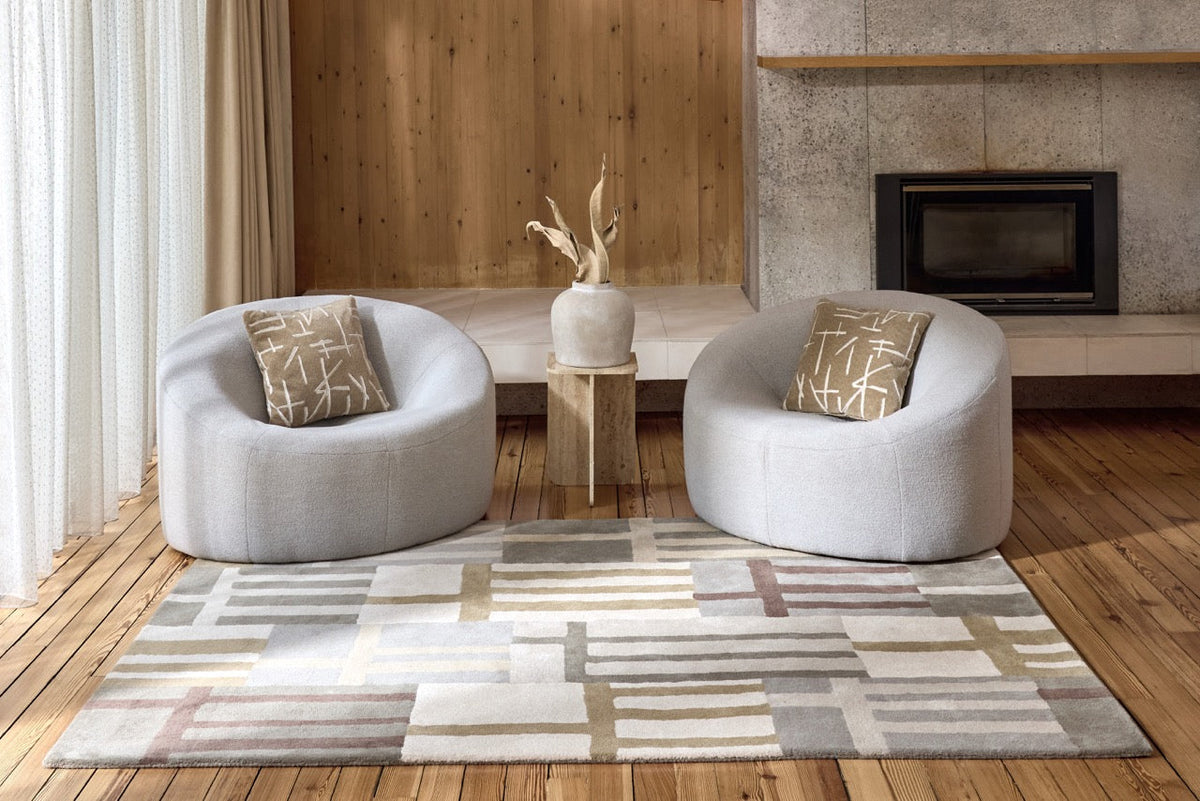 Harlequin Monolith Sandstone rug in sage grey, sand and ivory, shown in an interior