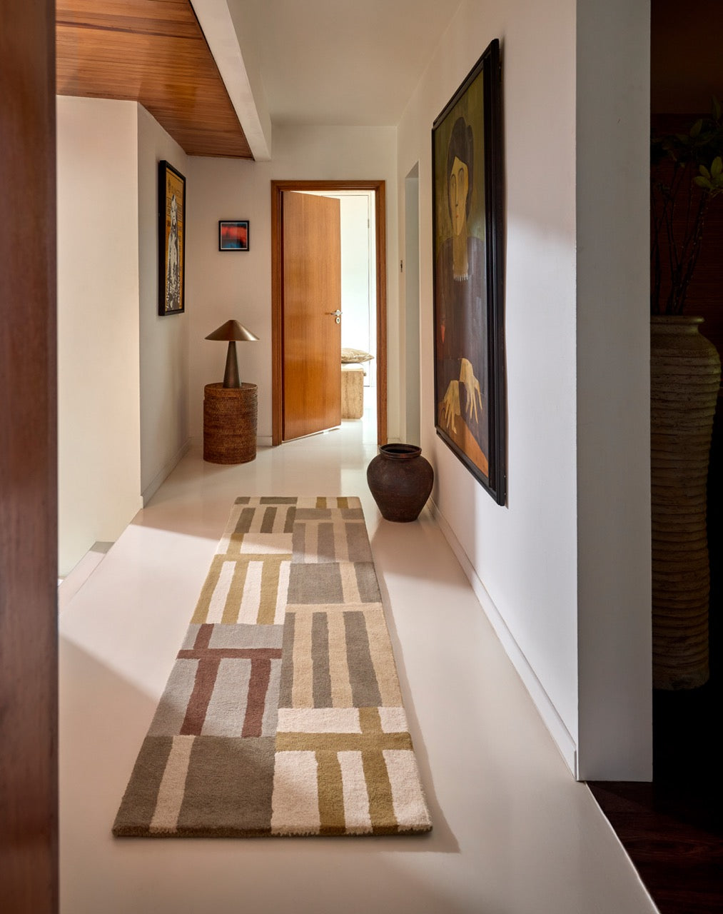 Harlequin Monolith Sandstone runner in sage grey, sand and ivory, shown in an interior