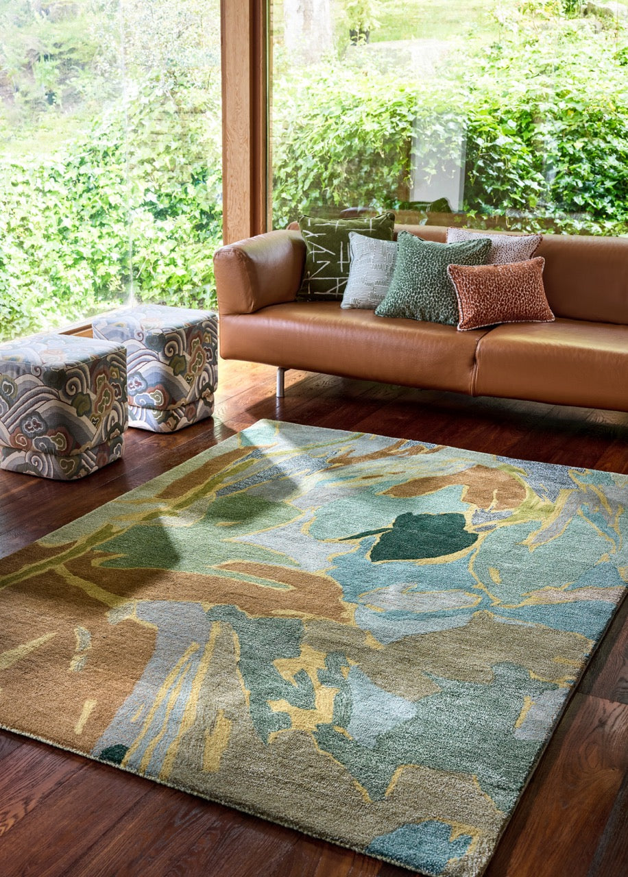 Harlequin Saltillo Forest rug in sage, sea green and cinnamon, shown in an interior