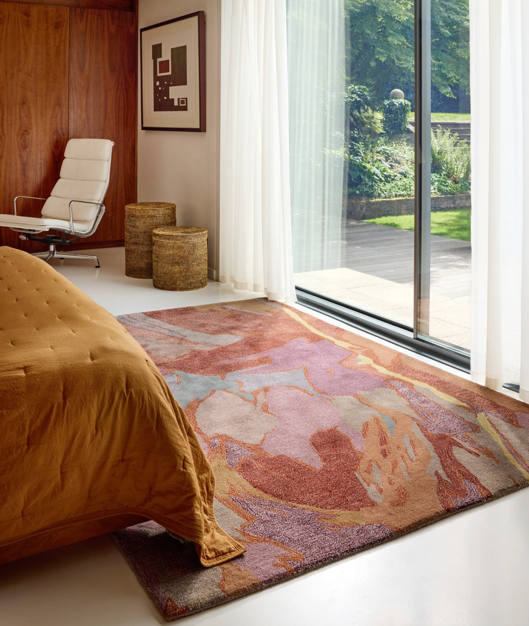 Harlequin Saltillo Rosewood rug in terracotta, rust and lilac, shown in an interior