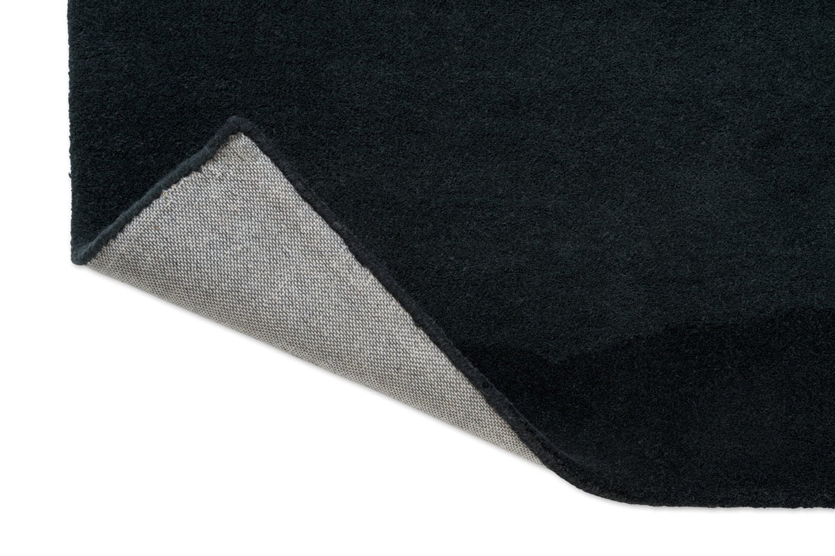 Harlequin Sedimentary Midnight rug, detail of folded corner and backing