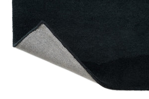 Harlequin Sedimentary Midnight rug, detail of folded corner and backing
