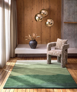 Harlequin Sedimentary Pine rug in pine green and sage, shown in an interior