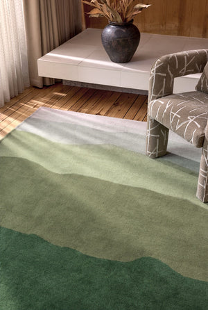 Harlequin Sedimentary Pine rug in pine green and sage, shown in an interior, second view