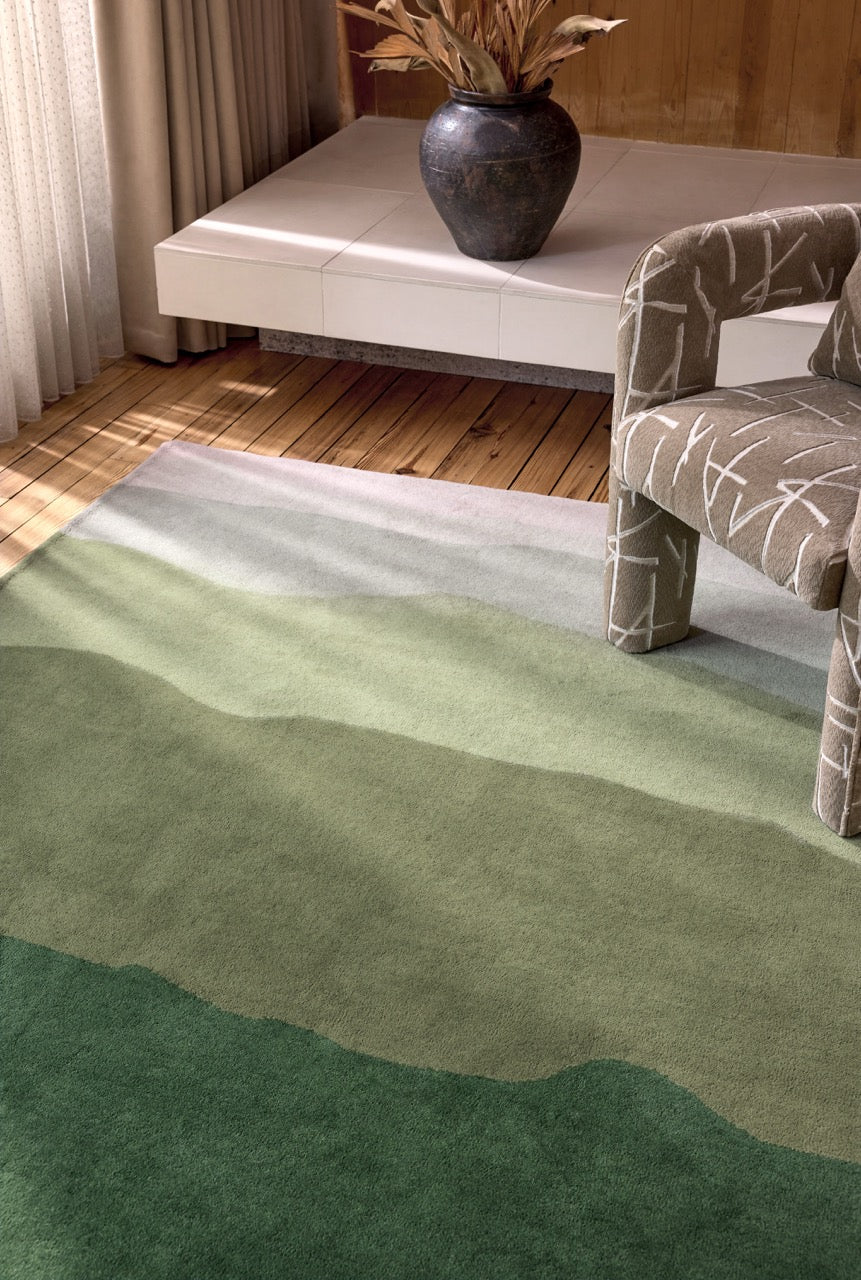 Harlequin Sedimentary Pine rug in pine green and sage, shown in an interior, second view