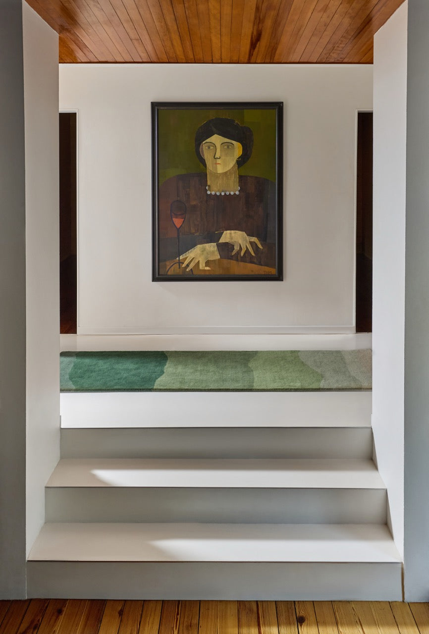 Harlequin Sedimentary Pine runner in pine green and sage, shown in an interior