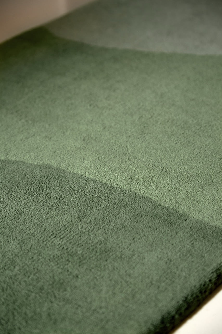 Harlequin Sedimentary Pine runner in pine green and sage, shown in an interior, third view