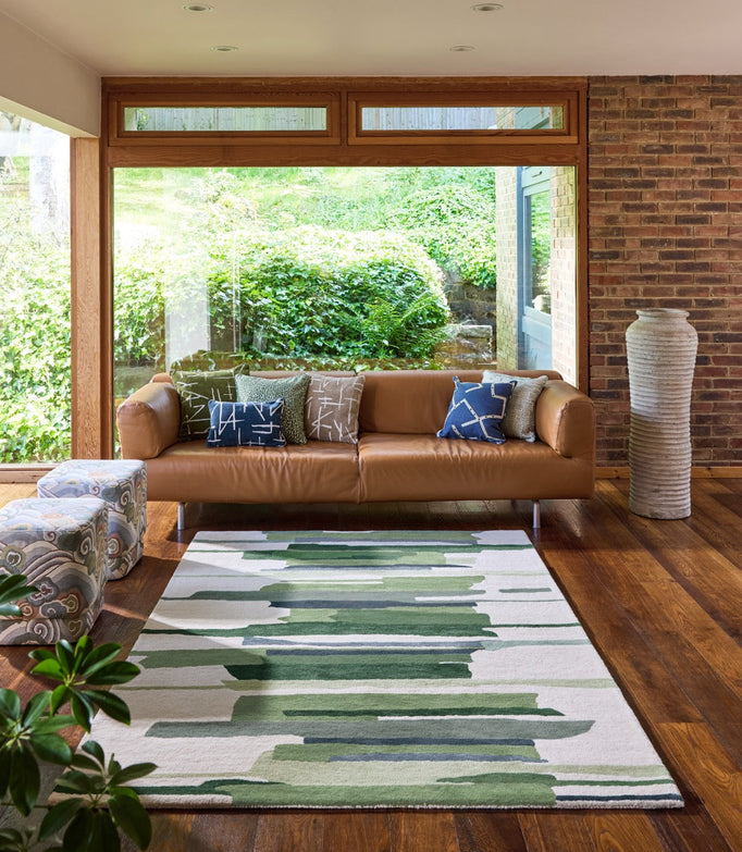 Harlequin Zeal Forest rug in ivory with green brushstrokes, shown in an interior