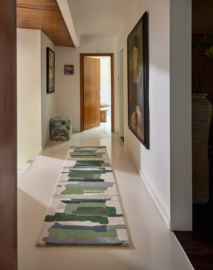 Harlequin Zeal Forest runner in ivory with green brushstrokes, shown in an interior
