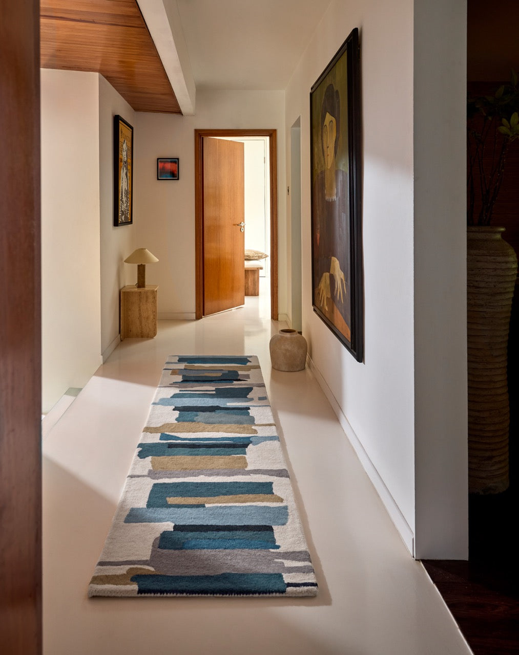 Harlequin Zeal Indigo runner in ivory with blue and ochre brushstrokes, second top view