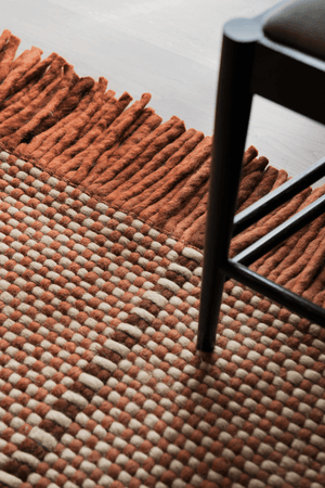 Rust Striped Wool Rug, Layered Cord Burgundy Rust, detail of the weave and fringes