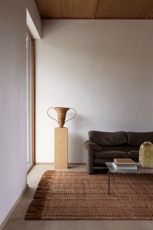 Rust Striped Wool Rug, Layered Cord Burgundy Rust, in a living room