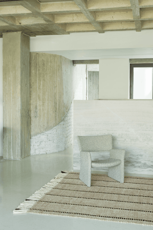 Black White Striped Wool Rug, Layered Cord, in a living room